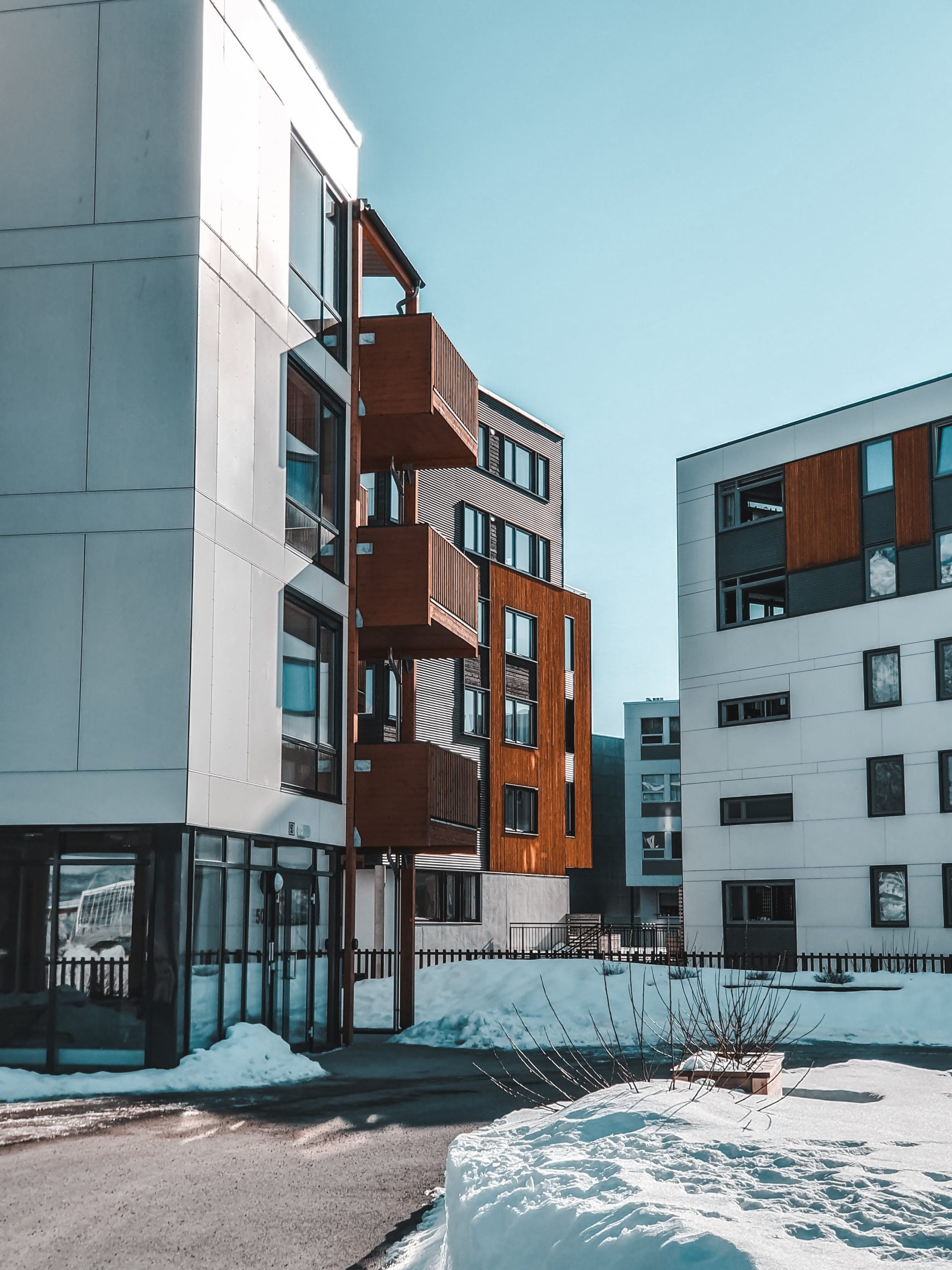 modern buildings with snow in the streets